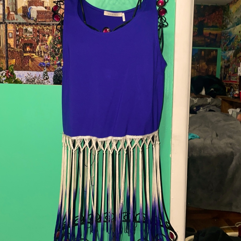 Purple crop top with white and purple fringes.